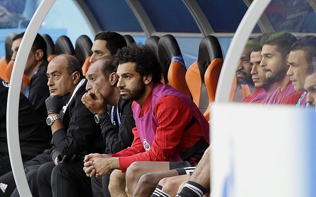 Egypt's Mohamed Salah, center, watches his team during the group A match between Egypt and Uruguay at the 2018 soccer World Cup in the Yekaterinburg Arena in Yekaterinburg, Russia, Friday, June 15, 2018. (AP Photo/Mark Baker) Egypt's Mohamed Salah, center, watches his team during the group A match between Egypt and Uruguay at the 2018 soccer World Cup in the Yekaterinburg Arena in Yekaterinburg, Russia, Friday, June 15, 2018. (AP Photo/Mark Baker)