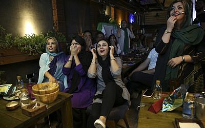 Iranian women react while watching the national soccer team play against Morocco in the 2018 World Cup, in downtown Tehran, Iran, June 15, 2018. (AP Photo/Vahid Salemi)