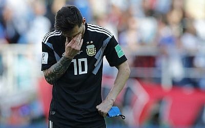 Argentina's Lionel Messi covers his face during the group D match between Argentina and Iceland at the 2018 soccer World Cup in the Spartak Stadium in Moscow, Russia, Saturday, June 16, 2018. (AP Photo/Ricardo Mazalan)