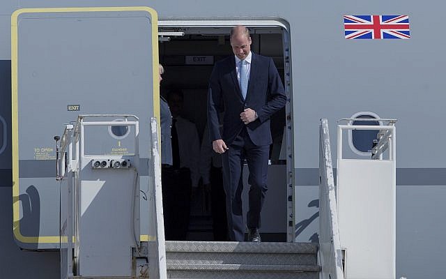 Britain's Prince William disembarks from a Royal Air Force plane after landing at the Marka airport in Amman, Jordan, June 24, 2018. (AP Photo/Nasser Nasser)