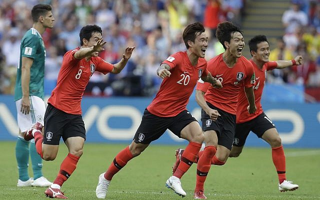 South Korean players celebrate after referee Mark Geiger from the US decided on goal after a VAR review during the group F match between South Korea and Germany, at the 2018 soccer World Cup in the Kazan Arena in Kazan, Russia, June 27, 2018. (AP Photo/Michael Probst)