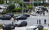 Maryland police officers block the intersection at the building entrance, after multiple people were shot at a newspaper in Annapolis, Md., June 28, 2018. (AP Photo/Jose Luis Magana)