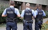 Illustrative: German police officers on guard outside the regional court in Frankfurt, Germany, September 15, 2014. (Michael Probst/AP)