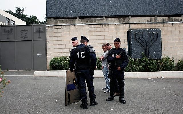 Illustrative photo of police officers standing guard in front of the Sarcelles synagogue, July 21, 2014 (AP Photo/Thibault Camus) Illustrative photo of police officers standing guard in front of the Sarcelles synagogue, July 21, 2014 (AP Photo/Thibault Camus)