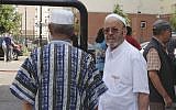 Muslim men shop in Trappes, southwest of Paris, Tuesday, July 23, 2013. (photo credit: AP/Elaine Ganley)