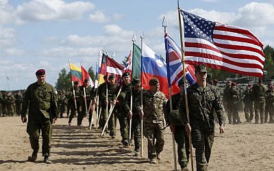 File: Soldiers from NATO countries attend an opening ceremony of military exercise 'Saber Strike 2015', at the Gaiziunu Training Range in Pabrade some 60km north of the capital Vilnius, Lithuania, June 8, 2015 (AP Photo/Mindaugas Kulbis)