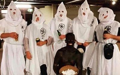 Students from Australia's Charles Sturt University are seen dressed in Ku Klax Klan uniforms and blackface for a 'politically incorrect' themed birthday party. (Twitter)
