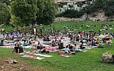 Participants in the local Jerusalem celebration of International Yoga Day received a specially designed yoga mat that together forms an artwork that envisions Jerusalem in thirty years from now (Courtesy The Big Dream - Jerusalem)