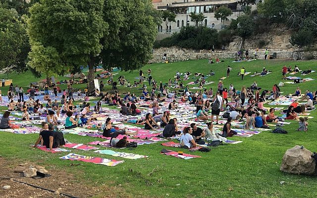 Participants in the local Jerusalem celebration of International Yoga Day received a specially designed yoga mat that together forms an artwork that envisions Jerusalem in thirty years from now (Courtesy The Big Dream - Jerusalem) Participants in the local Jerusalem celebration of International Yoga Day received a specially designed yoga mat that together forms an artwork that envisions Jerusalem in thirty years from now (Courtesy The Big Dream - Jerusalem)