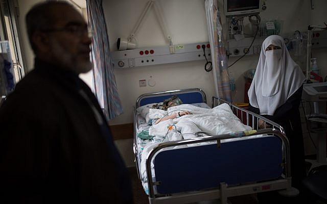 Illustrative: A Palestinian woman receives treatment at the Wolfson Medical Center in the central Israeli city of Holon, on April 11, 2018. (Hadas Parush/Flash90) Illustrative: A Palestinian woman receives treatment at the Wolfson Medical Center in the central Israeli city of Holon, on April 11, 2018. (Hadas Parush/Flash90)
