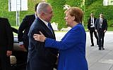 Prime Minister Benjamin Netanyahu is greeted by German Chancellor Angela Merkel (R) in Berlin, Germany on June 4, 2018. (Haim Zach/GPO/Flash90)