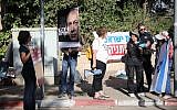Protesters outside the Prime Minister's Residence in Jerusalem awaiting the arrival of police investigators coming to question Prime Minister Benjamin Netanyahu in a graft investigation, June 12, 2018. (Hadas Parush/Flash90)