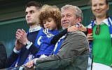 Chelsea owner Roman Abramovich looks on as Chelsea win the Premier League title after the Barclays Premier League match between Chelsea and Crystal Palace at Stamford Bridge on May 3, 2015 in London, England. (Clive Mason/Getty Images via JTA)