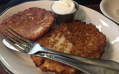 Crispy -- and not too salty -- potato latkes at B&H dairy restaurant in New York. (Jordan Hoffman/ Times of Israel)