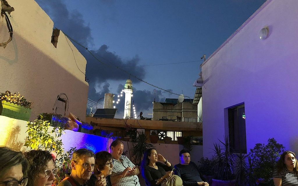 An illuminated Kafr Qara misgad, as seen from the patio of resident Amna Kanana during a tour called Ramadan Nights, June 2018. (Amanda Borschel-Dan/Times of Israel)