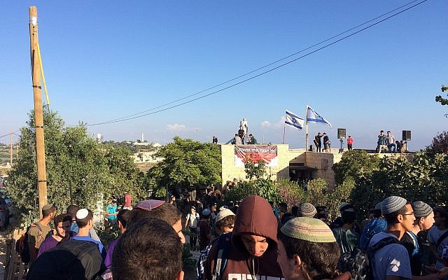 Protesters at the Netiv Ha'avot outpost in the Gush Etzion area of the West Bank shortly before the expected demolition of 15 homes built illegally, on June 12, 2018. (Luke Tress/Times of Israel)