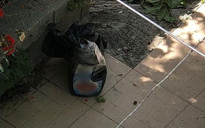 A bomb found in the yard of a Palestinian home near a security checkpoint in the West Bank city of Hebron on June 22, 2018. (Israel Police)