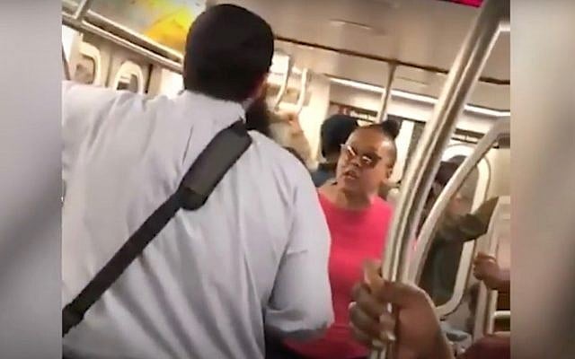 A screenshot from a video of Shauntaye King yelling at Yossi Wolfe on a New York City subway car. (Screen capture: YouTube) A screenshot from a video of Shauntaye King yelling at Yossi Wolfe on a New York City subway car. (Screen capture: YouTube)