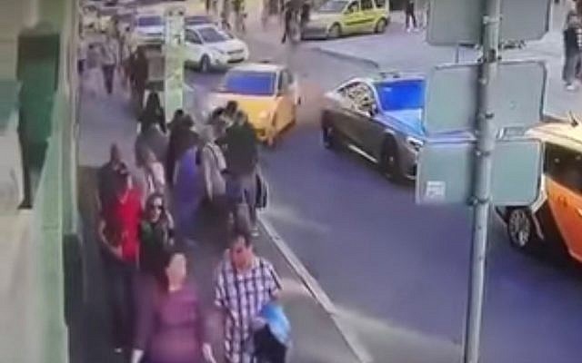 A taxi is seen crashing into a group of pedestrians in Moscow on June 16, 2018. (Screen capture: YouTube) A taxi is seen crashing into a group of pedestrians in Moscow on June 16, 2018. (Screen capture: YouTube)