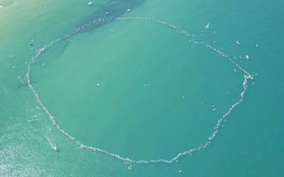 Israelis set the record for the world's largest 'surfing paddle-out' in the Mediterranean Sea off the coast of Herzliya, as part of a protest against natural gas drilling near Israel's coastline. (Screen capture: Hadashot news)