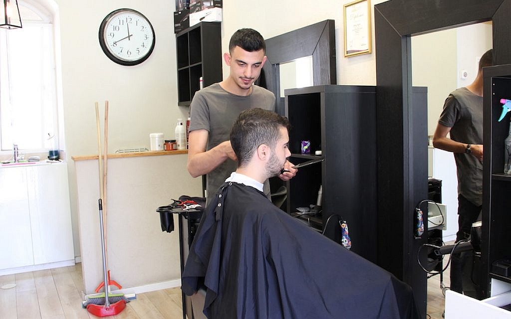 Ido Vital’s hair salon is located in the popular Mahane Yehuda market in Jerusalem. (Tracy Frydberg/JTA) Ido Vital’s hair salon is located in the popular Mahane Yehuda market in Jerusalem. (Tracy Frydberg/JTA)