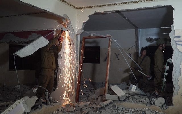 Israeli troops on June 21, 2018 demolish the northern West Bank home of Palestinian Ala Qabha, who rammed his car into a group of soldiers, killing two soldiers. (Israel Defense Forces)