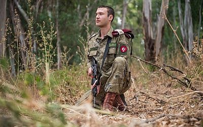 An IDF soldier models one of the new styles of work uniforms that the military is considering putting into service, on June 24, 2018. (Israel Defense Forces)