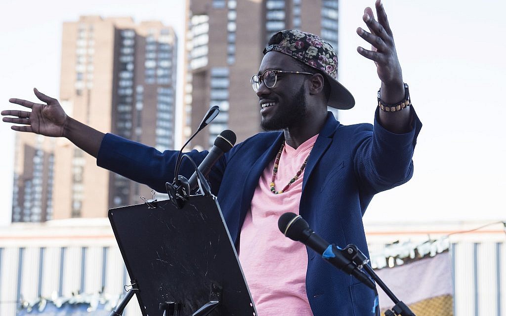 Yehuda Webster speaks at the Juneteenth seder put on by JFREJ, held alongside the East River in New York City on June 14, 2018. (Rafael Shimunov)