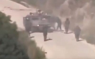 Hezbollah gunmen converge on a stricken IDF Humvee during July 2006 attack (YouTube screenshot)