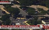 People leave the building of The Capital newspaper in Annapolis, Maryland after shooting on June 28, 2018. (Screen capture: CBSN)