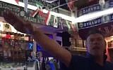 British soccer fan gives Nazi salute in a bar in Volgograd, Russia (YouTube screenshot)