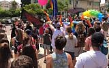 Participants in Kfar Saba's inaugural Gay Pride Parade on June 1, 2018. (Screen capture: Ynet news)