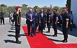 Israeli Defense Minister Avigdor Liberman, flanked by his Cypriot colleague Savvas Angelides, center, and Greek Defense Minister Panos Kammenos, reviews an honor guard in Cyprus on June 22, 2018. (Ariel Hermoni/Israeli Defense Ministry)