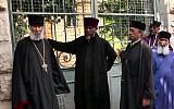 Ethiopian monks gather outside an Ethiopian Church owned complex from which police evicted them on May 31, 2018. The eldest, aged 84, stands on the left. (Channel 10 News screenshot)