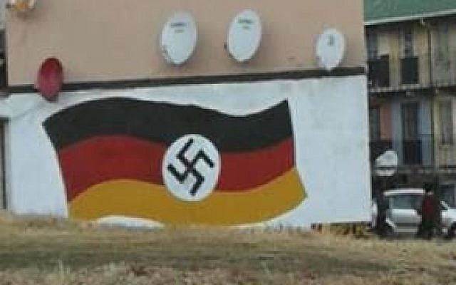 A German flag with Nazi swastika graffitied on a wall in Johannesburg, South Africa, on June 20, 2018. (South Africa Jewish Board of Deputies) A German flag with Nazi swastika graffitied on a wall in Johannesburg, South Africa, on June 20, 2018. (South Africa Jewish Board of Deputies)