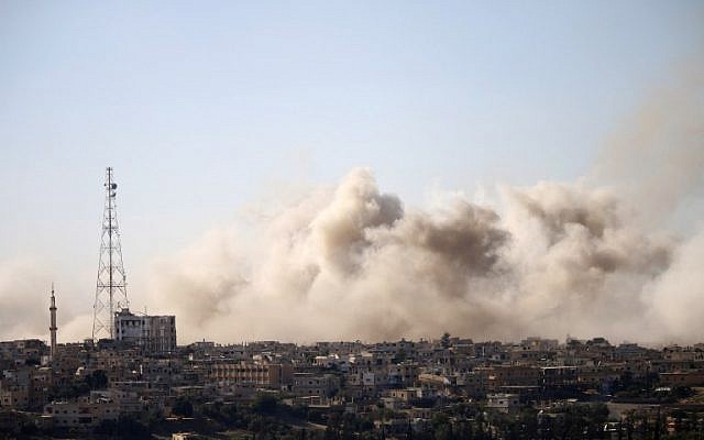 Smoke rises above rebel-held areas of the city of Daraa during airstrikes by Syrian regime forces on June 30, 2018.
(AFP/ Mohamad ABAZEED) Smoke rises above rebel-held areas of the city of Daraa during airstrikes by Syrian regime forces on June 30, 2018.
(AFP/ Mohamad ABAZEED)