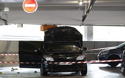 This picture taken in Aulnay-sous-Bous north of Paris on July 1, 2018, shows a car abandoned by French robber Redoine Faid at O'Parinor shopping mall parking after he escaped on a helicopter from a prison in Reau. (AFP Photo/Geoffroy Van Der Hasselt)