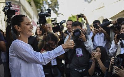 Claudia Sheinbaum of the "Juntos haremos historia" coalition party, gives her thumb up after casting her vote during the general elections in Mexico City, on July 1, 2018. (AFP/ Bernardo Montoya)