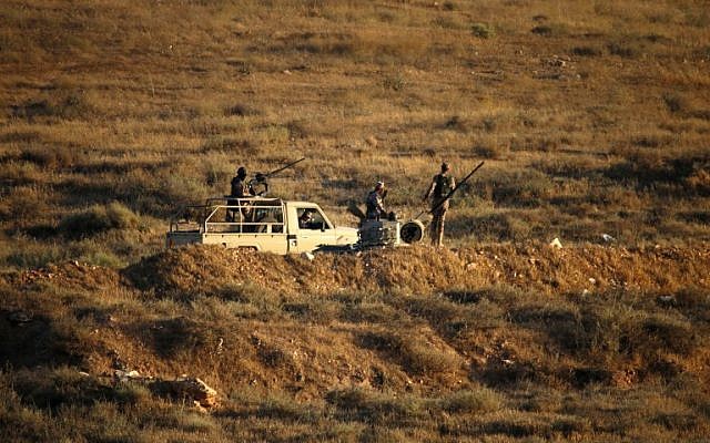 Jordanian soldiers control the border between Syria and Jordan, near the town of Nasib, southern Syria, on July 1, 2018.
( AFP/ Mohamad ABAZEED) Jordanian soldiers control the border between Syria and Jordan, near the town of Nasib, southern Syria, on July 1, 2018.
( AFP/ Mohamad ABAZEED)