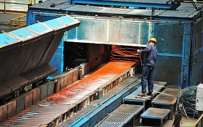 Illustrative: A worker handling red hot steel cables at a steel factory, in Qingdao in China's eastern Shandong province, on June 8, 2018. (AFP Photo)