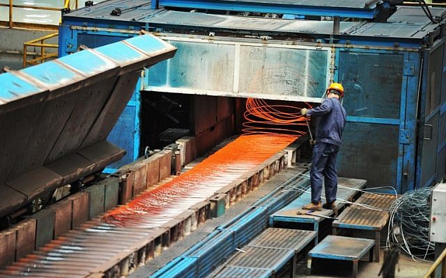 Illustrative: A worker handling red hot steel cables at a steel factory, in Qingdao in China's eastern Shandong province, on June 8, 2018. (AFP Photo) Illustrative: A worker handling red hot steel cables at a steel factory, in Qingdao in China's eastern Shandong province, on June 8, 2018. (AFP Photo)