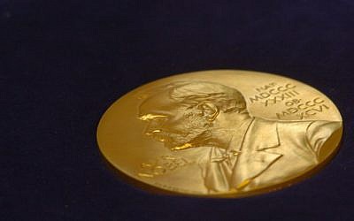 In this photo taken on May 07, 2005 the gold replica of the Nobel medal is on display during the function of the Replacement of the Nobel Medallion at Shantiniketan, about 200 kms north of Calcutta. (AFP PHOTO / Desha-Kalyan CHOWDHURY)