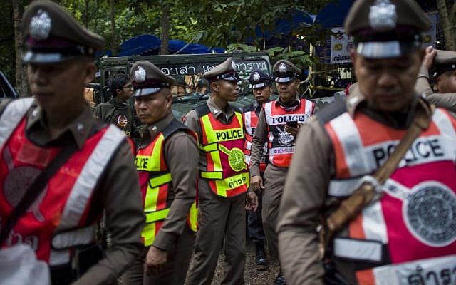 Illustrative: Thai policemen stand guard outside a cave during a rescue operation for 12 boys and their coach trapped in the cave at the Khun Nam Nang Non Forest Park in the Mae Sai district of Chiang Rai province, Thailand on July 4, 2018. (AFP PHOTO / YE AUNG THU)
