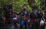 Thai divers carry supplies as rescue operations continue for 12 boys and their coach trapped at Tham Luang cave in the Chiang Rai province on July 5, 2018. (AFP PHOTO / YE AUNG THU)