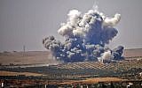 Smoke rises above rebel-held areas of the city of Daraa, during reported airstrikes by Syrian regime forces on July 5, 2018 (AFP PHOTO/Mohamad ABAZEED)