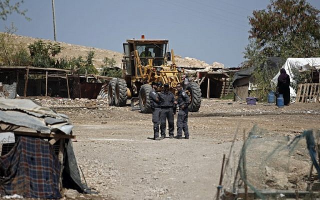 Israeli forces guard the access to the Bedouin village of Khan al-Ahmar in the West Bank east of Jerusalem, July 5, 2018. (AFP Photo/Thomas Coex) Israeli forces guard the access to the Bedouin village of Khan al-Ahmar in the West Bank east of Jerusalem, July 5, 2018. (AFP Photo/Thomas Coex)
