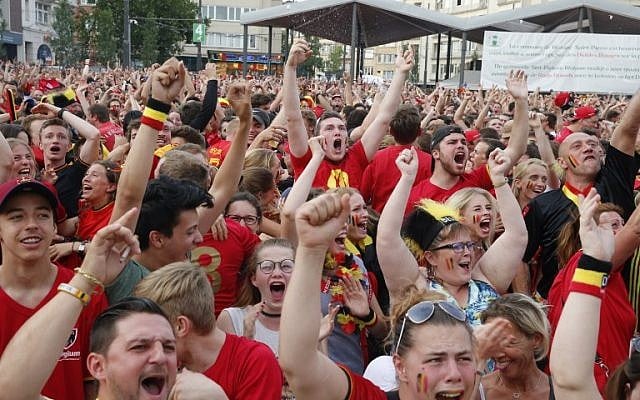 Illustrative: Belgian soccer fans celebrate after the Belgium's goal as they watch the Russia 2018 World Cup quarter-final match between Brazil and Belgium, in Woluwe, Brussels, on July 6, 2018. (AFP Photo/Belga/Nicolas Maeterlinck) Illustrative: Belgian soccer fans celebrate after the Belgium's goal as they watch the Russia 2018 World Cup quarter-final match between Brazil and Belgium, in Woluwe, Brussels, on July 6, 2018. (AFP Photo/Belga/Nicolas Maeterlinck)