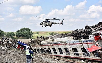 A helicopter flies over the site where a train derailed at Corlu district in Tekirdag, northwest Turkey, on July 9, 2018. (AFP PHOTO / DHA)
