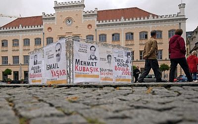Banners with the names and pictures of victims of the National Socialist Underground (NSU) are fixed at a framework in Zwickau, eastern Germany, on July 10, 2018. (AFP / dpa / Hendrik Schmidt)