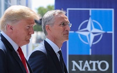 US President Donald Trump (L) walks with NATO Secretary General Jens Stoltenberg as he arrives to attend the NATO (North Atlantic Treaty Organization) summit, in Brussels, on July 11, 2018. (AFP/Pool/Tatyana Zenkovich)